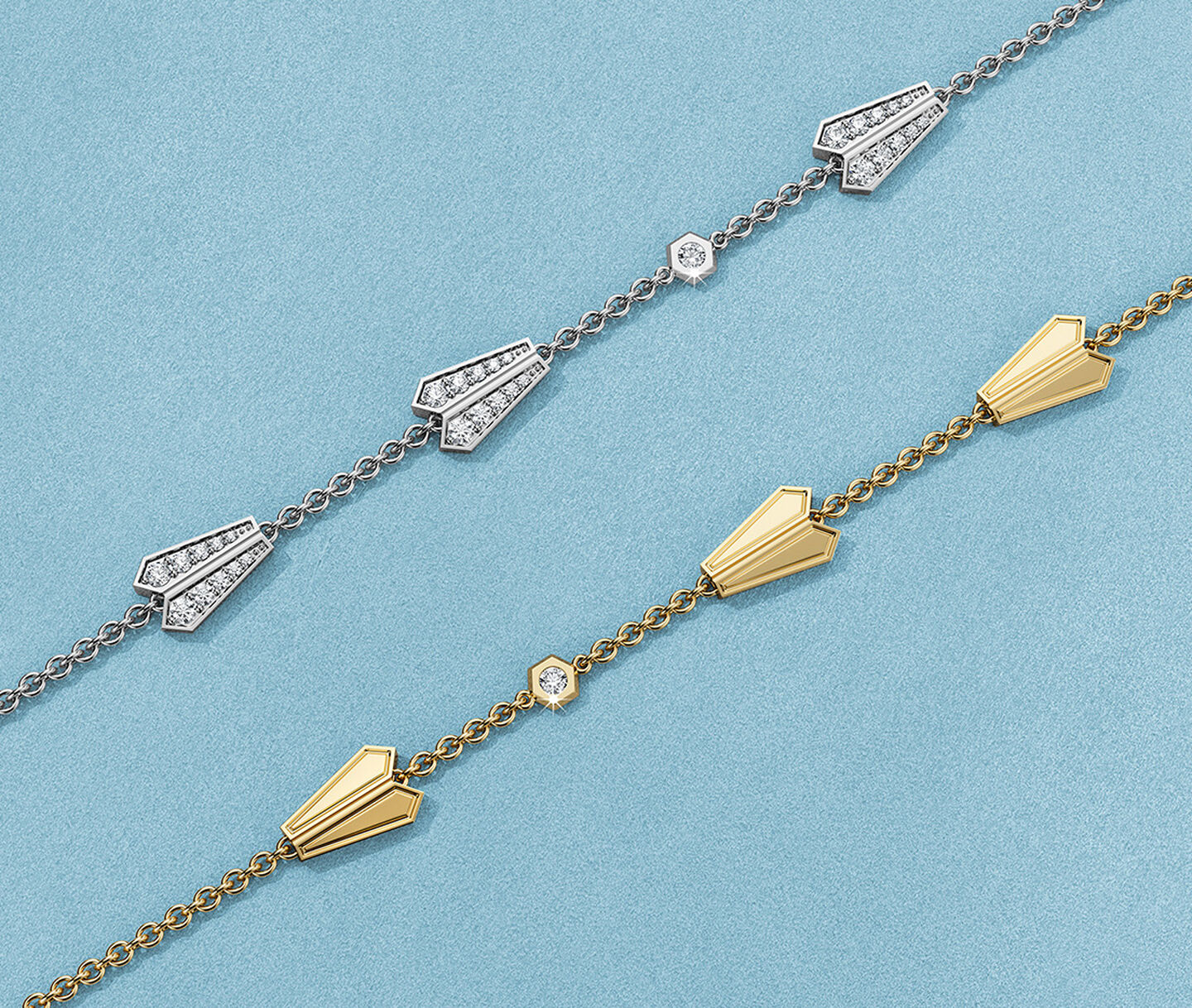 Birks Beekeeper yellow and white gold diamond bracelets on a blue background.