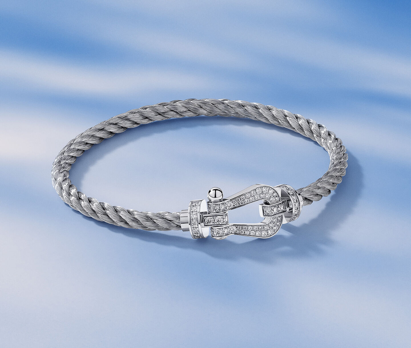 FRED Force 10 bracelet on a blue background.