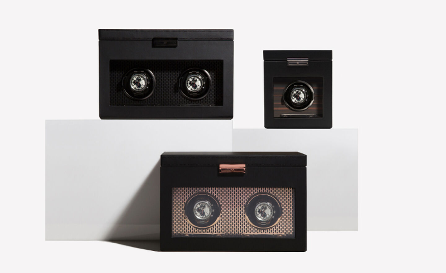 Three black watch winder storage cases