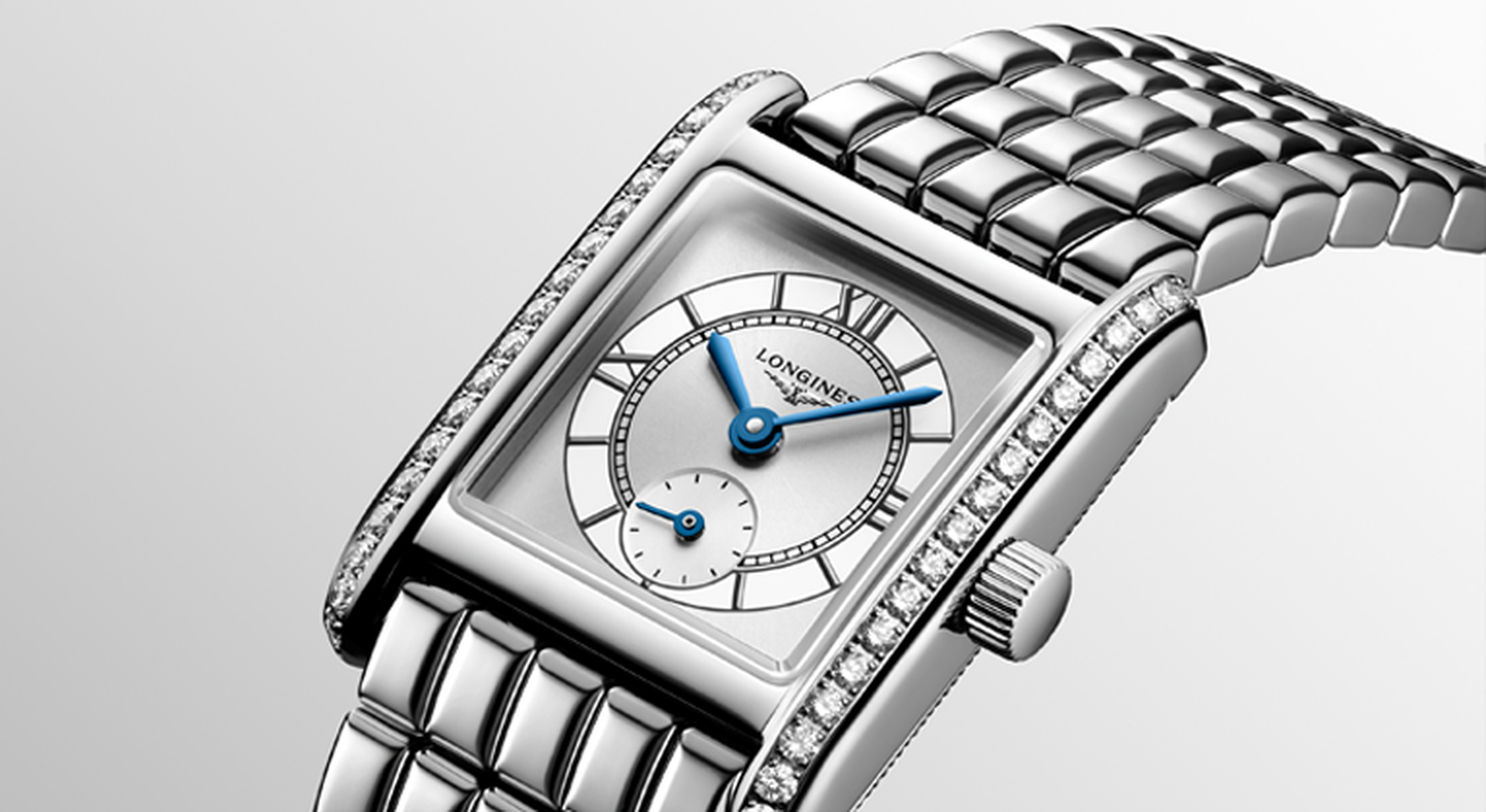 Longines dolce vita watch on a greige background.