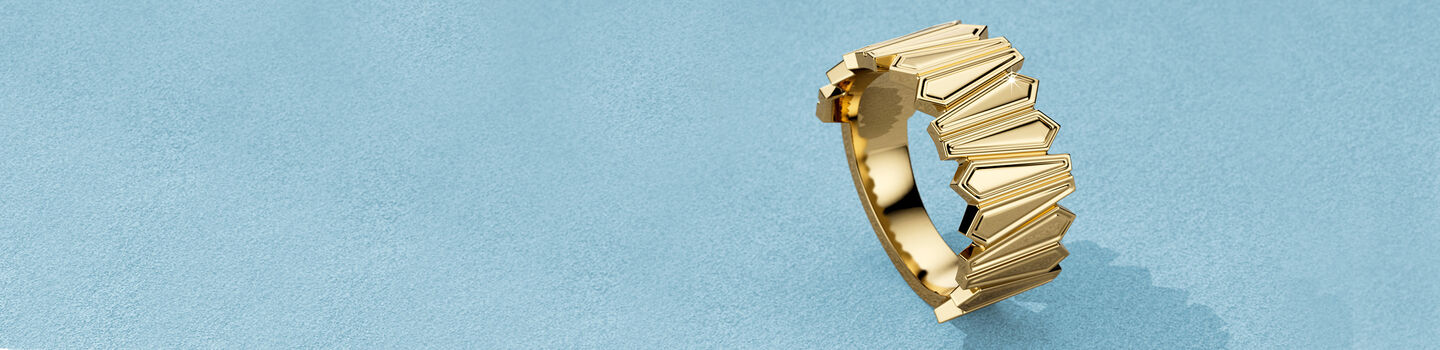 Birks Beekeeper yellow gold ring on a blue background.