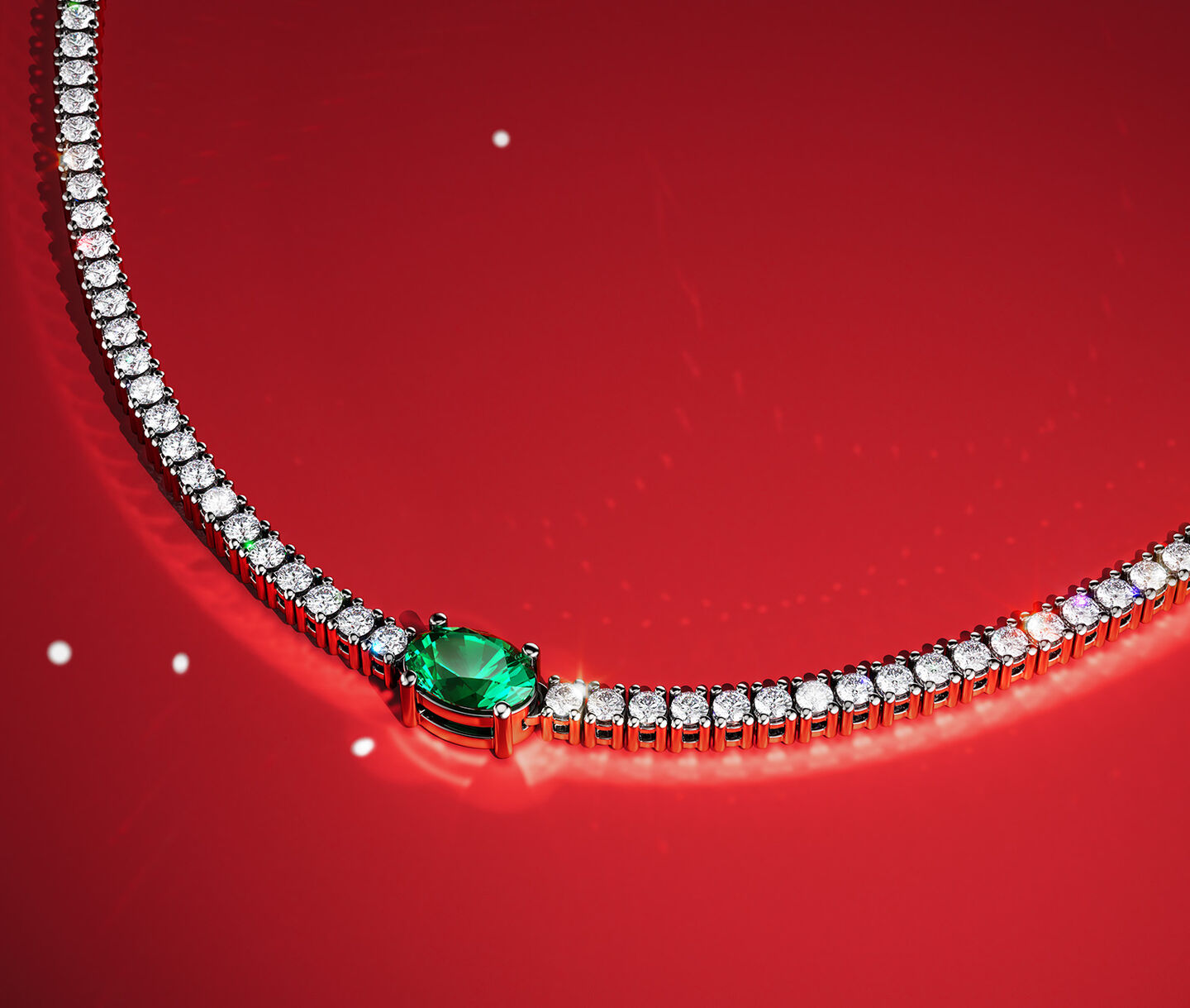 Birks essentials emerald and diamond line necklace on a red holiday background.