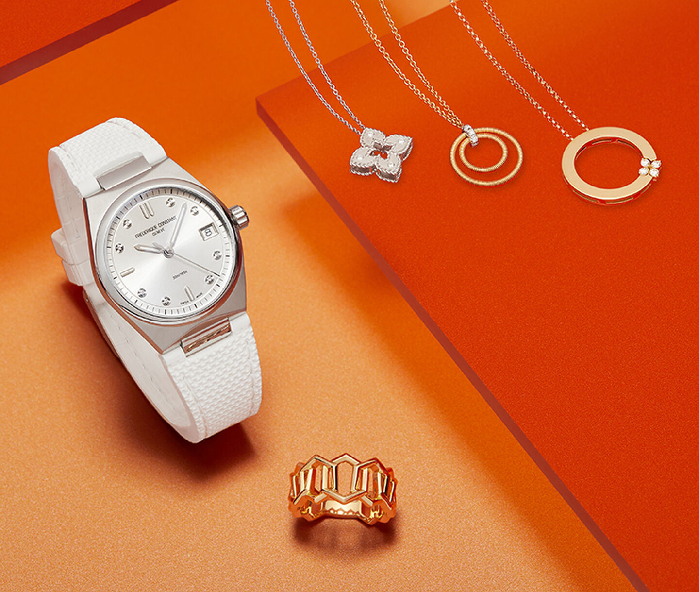 A watch, three pendant necklaces and a gold ring