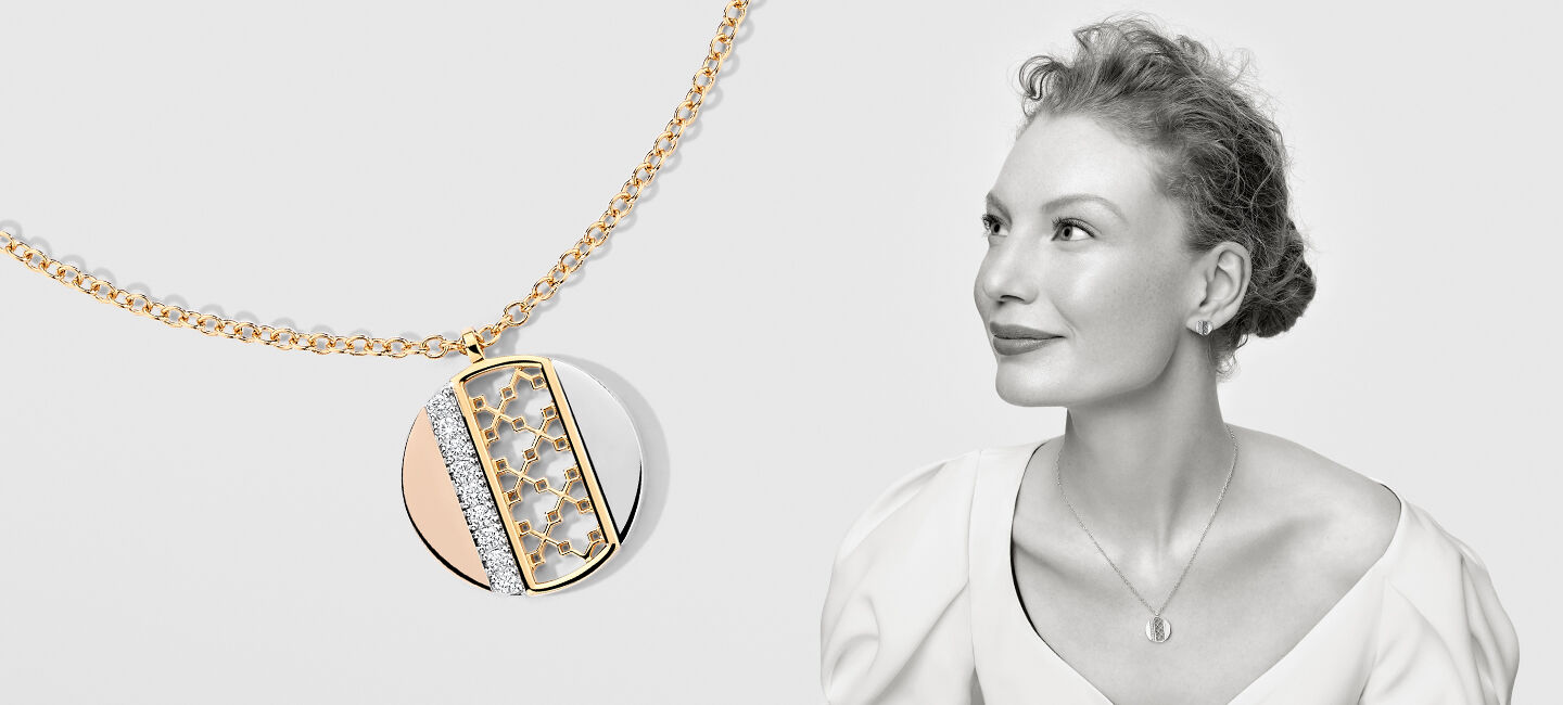 Model with Birks Dare to Dream trigold circle pendant