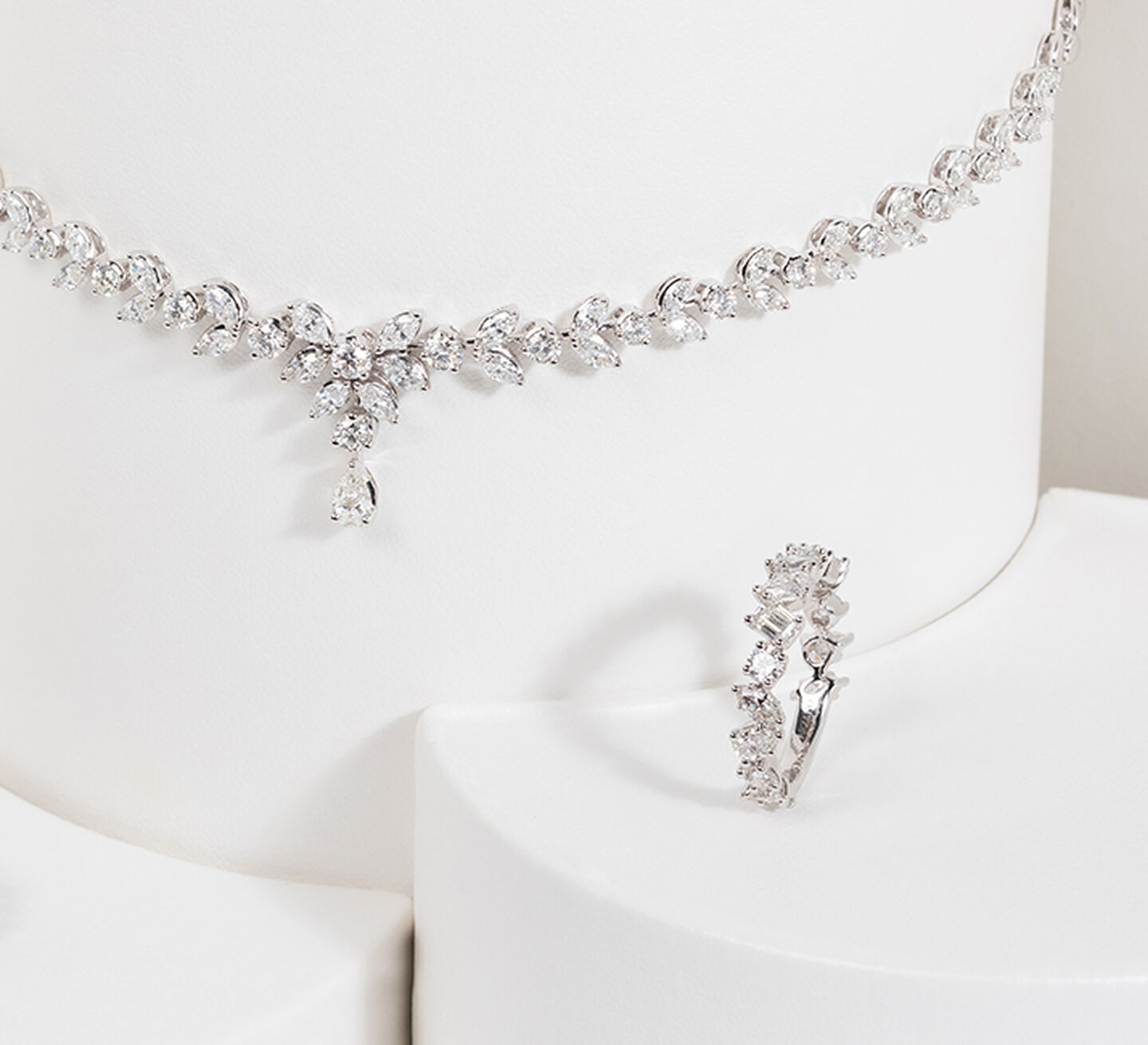 A diamond necklace and matching white gold ring