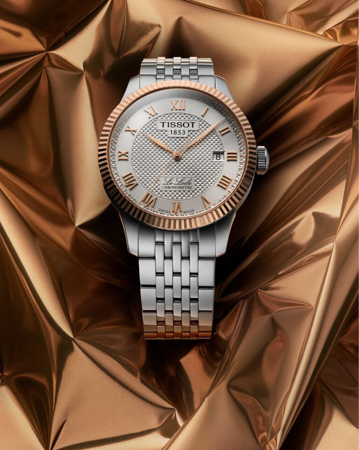 Tissot Classic Traditional watch on a gold background.