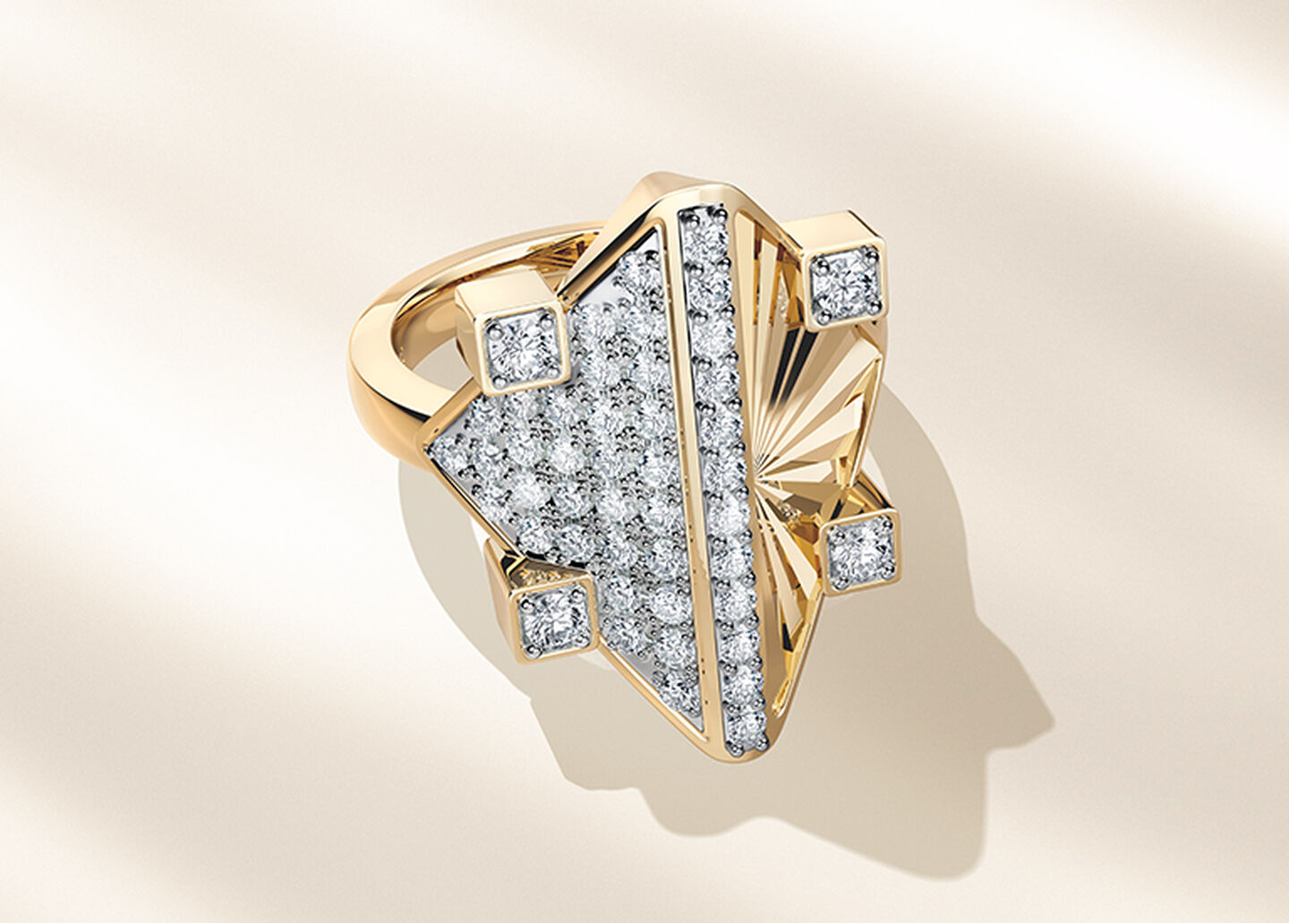 Birks Muse Exceptional yellow gold and diamond ring on a beige background.