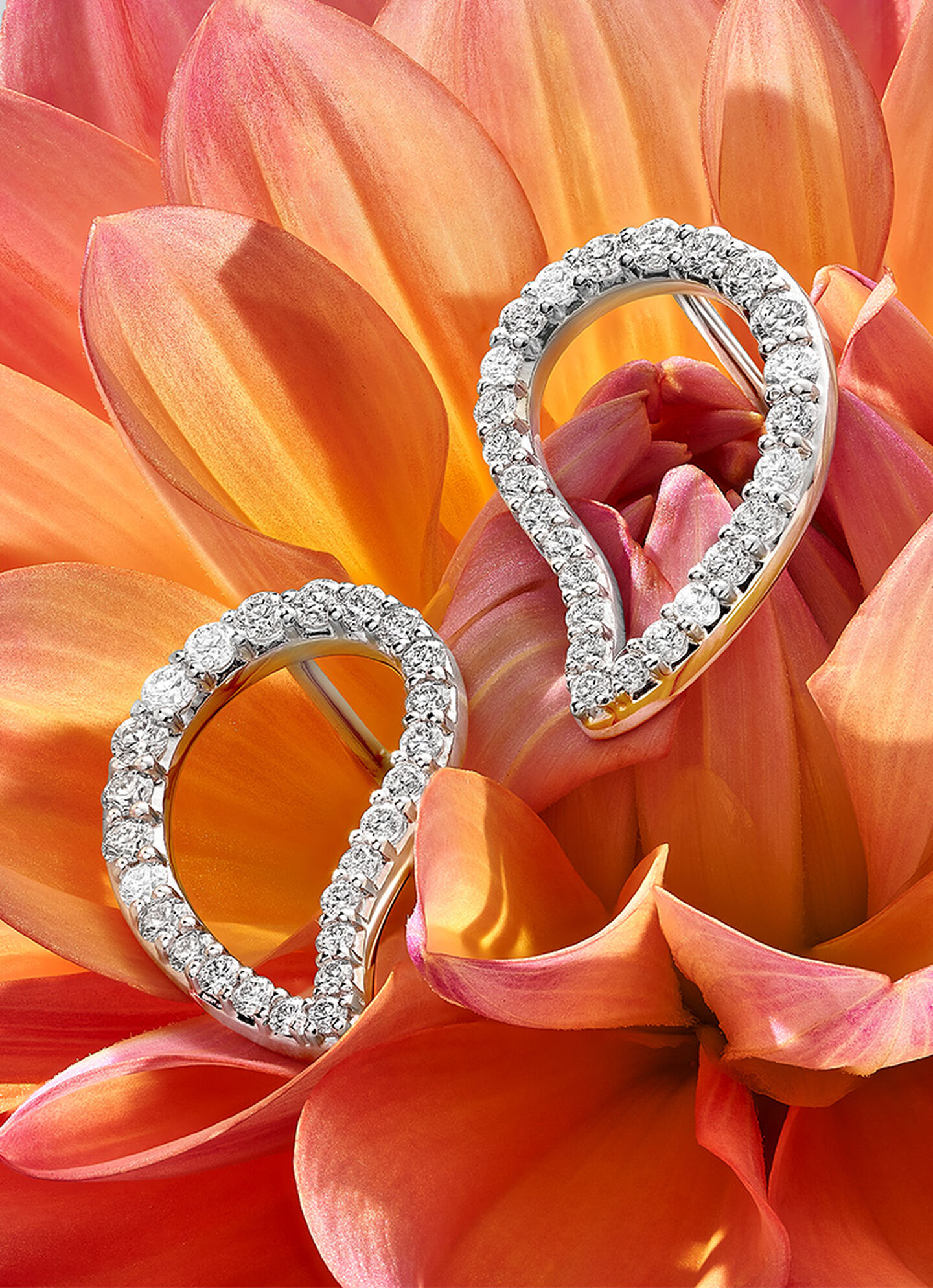 Birks Pétale diamond earrings on a flower.