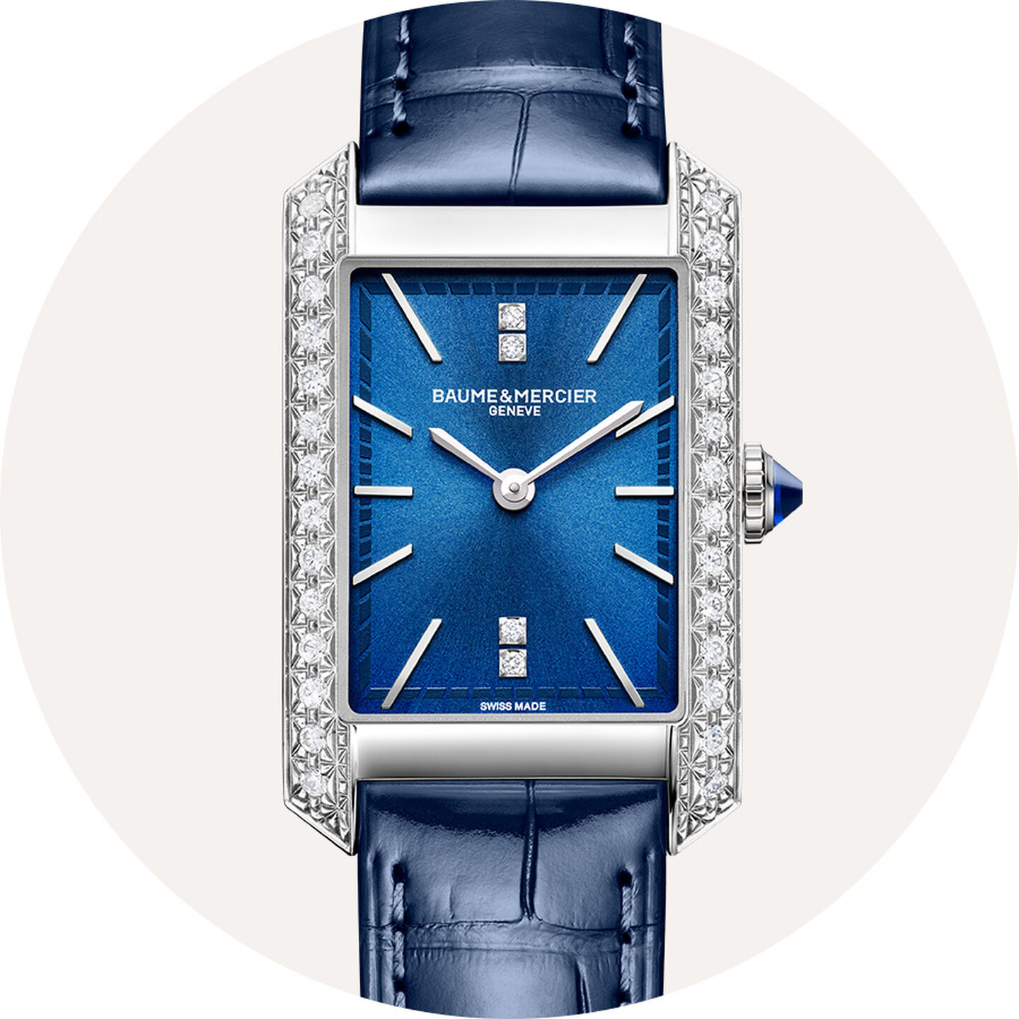 Baume & Mercier watch on a grey background.