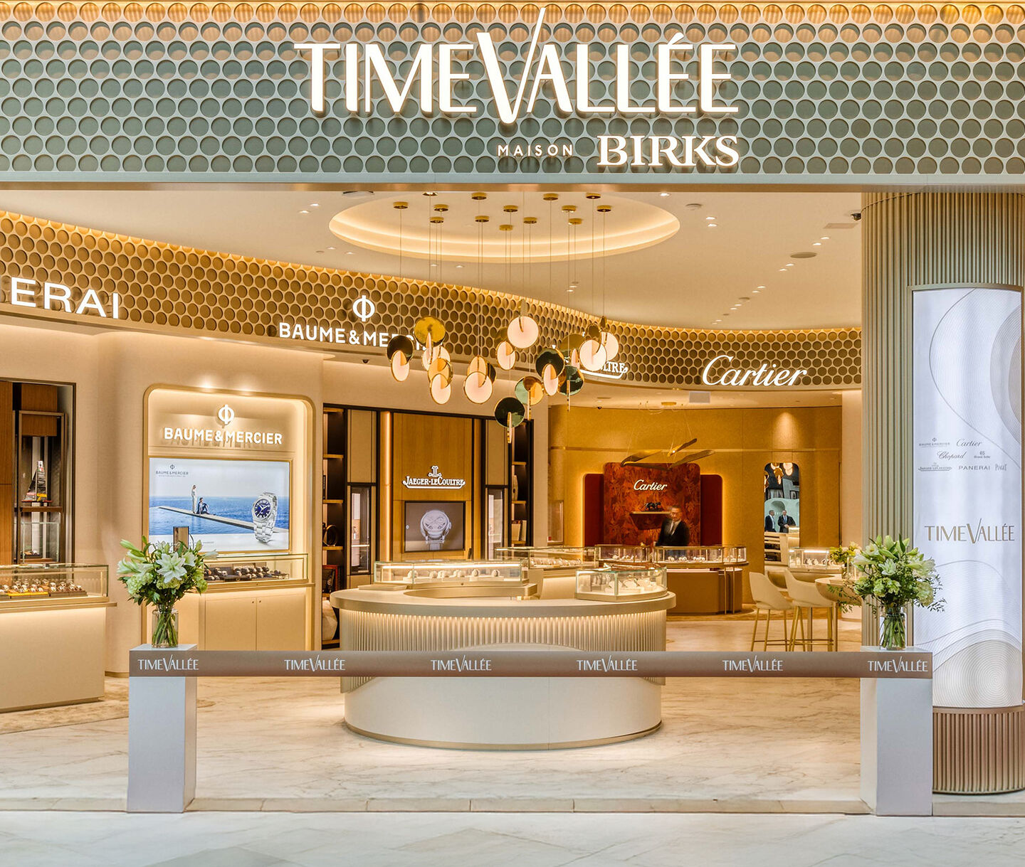 Entrance of TimeVall&eacute;e at Maison Birks with luxury watch displays.