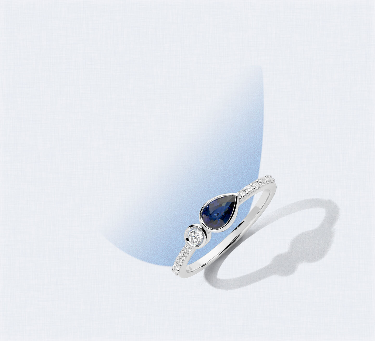 A sapphire and diamond white gold ring