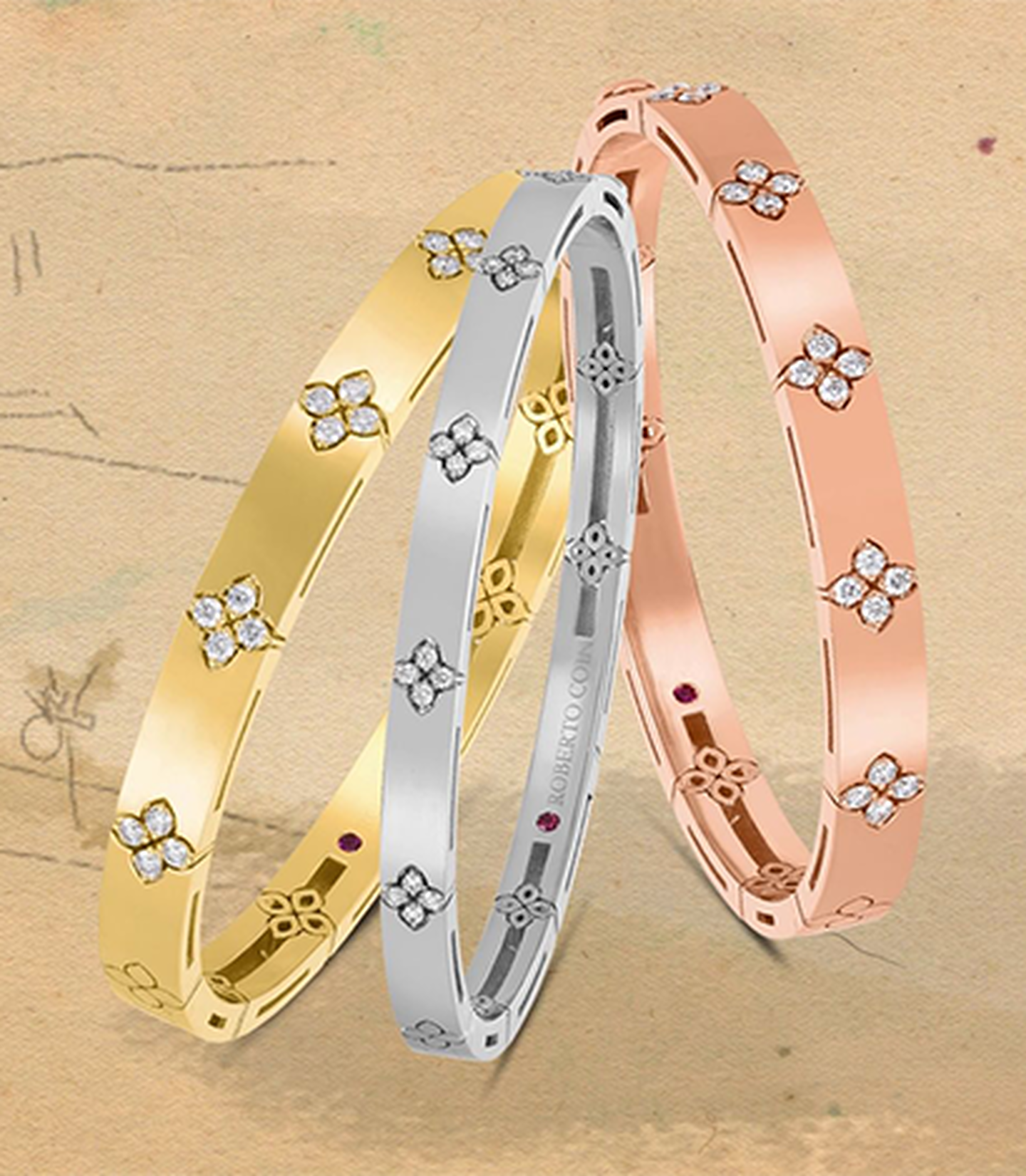 Three Roberto Coin white, yellow and rose gold bracelets with diamond accents
