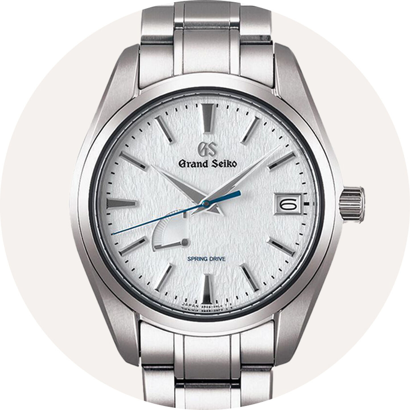 Grand Seiko watch on a grey background.