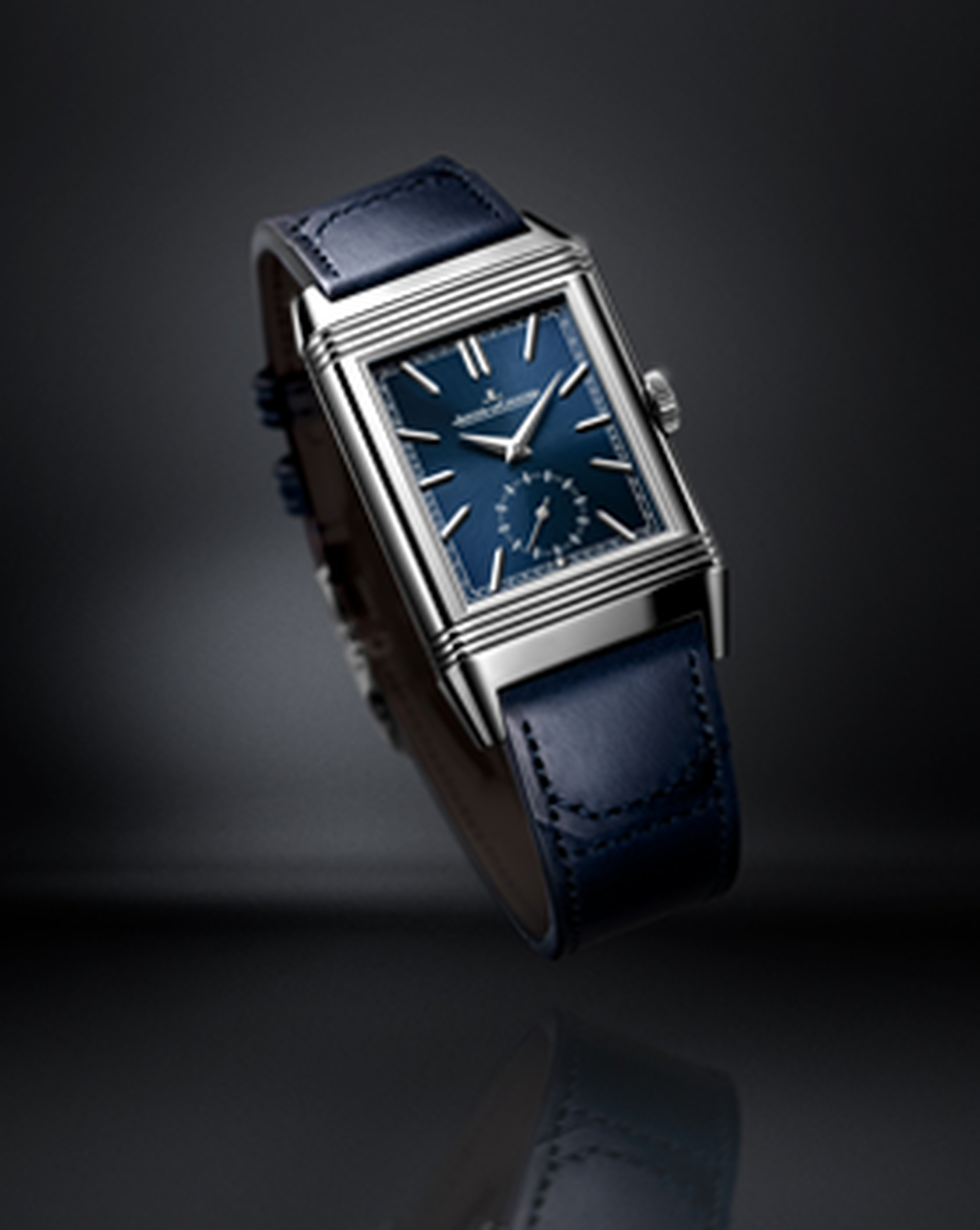 Jaeger-LeCoultre Reverso watch on a dark background.
