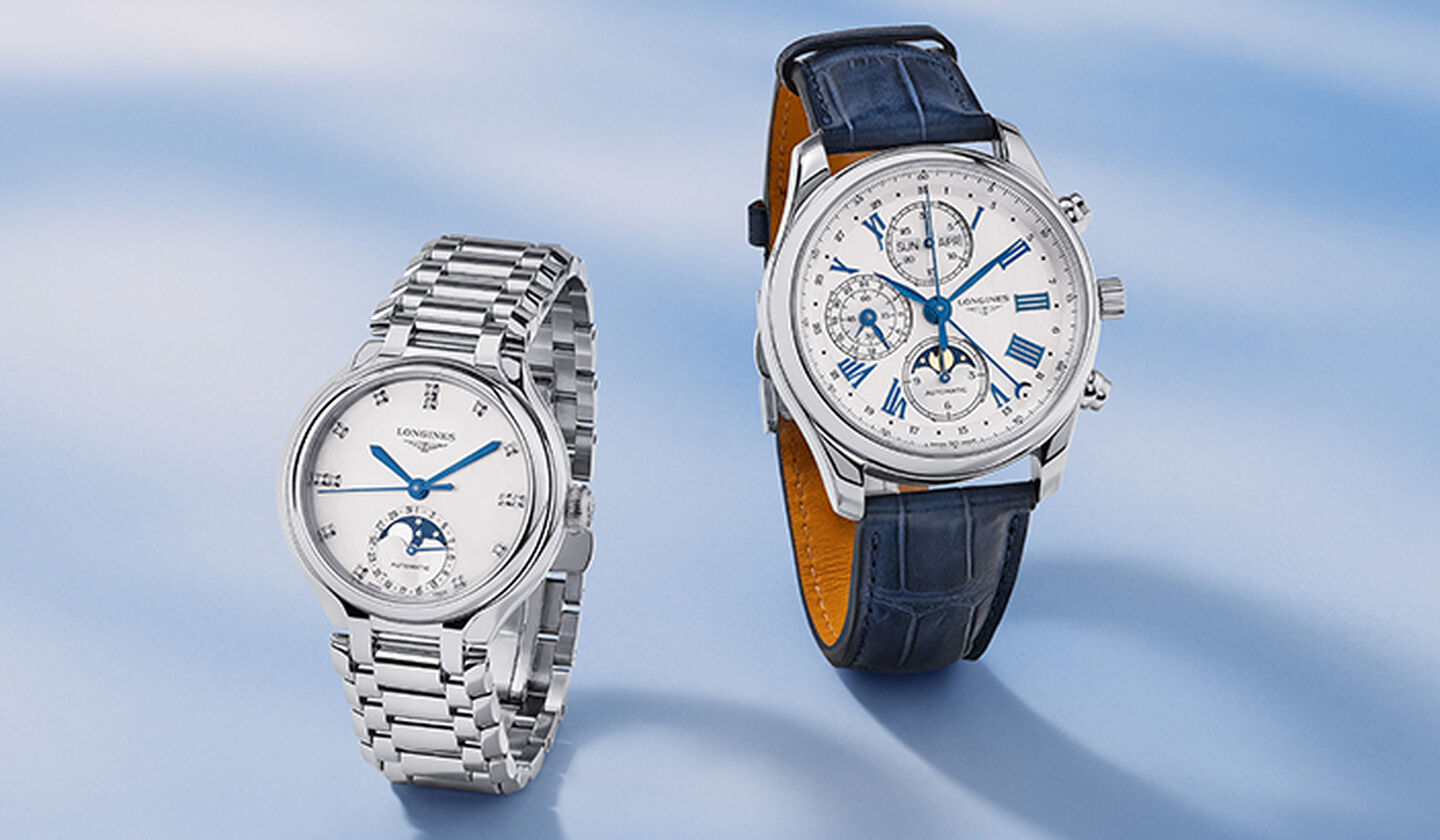 Two Longines watches on a blue background.
