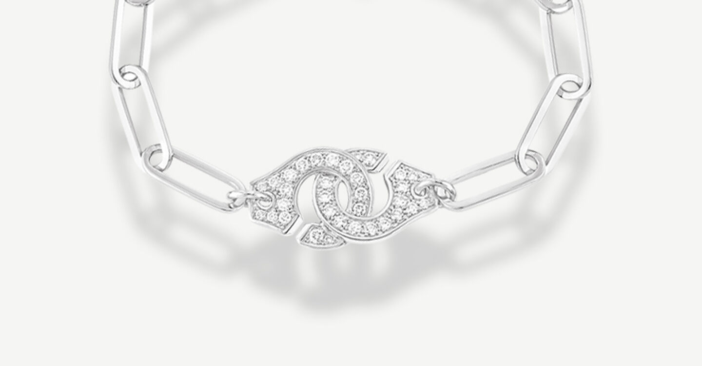 Menottes dinh van white gold and diamond bracelet