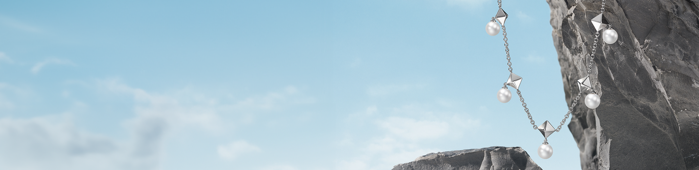 Birks Rock & Pearl on a mountain rock and blue sky background.