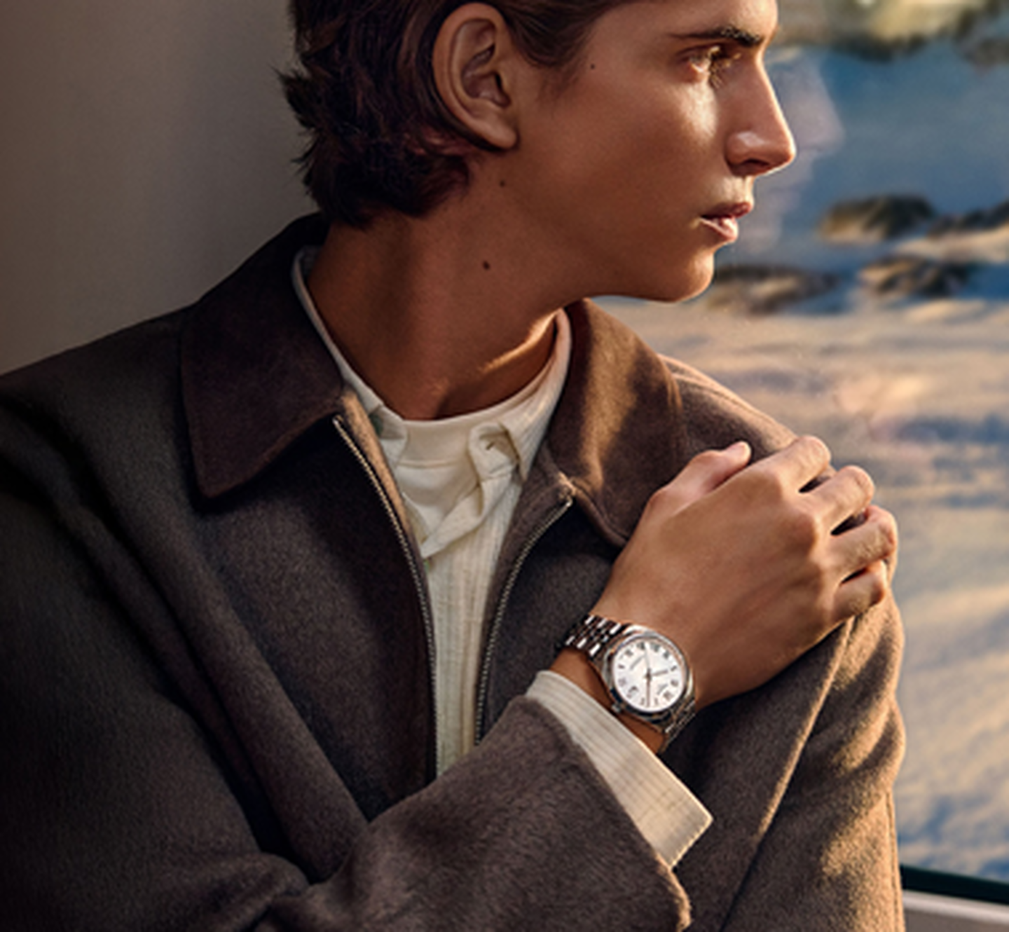 A man wearing a Tissot watch.