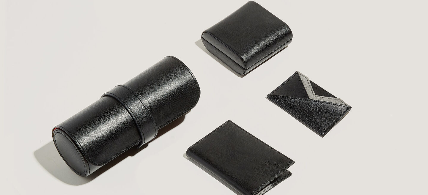 Four black leather accessories