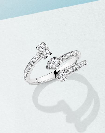 Birks Splash diamond ring on a white and light blue background.