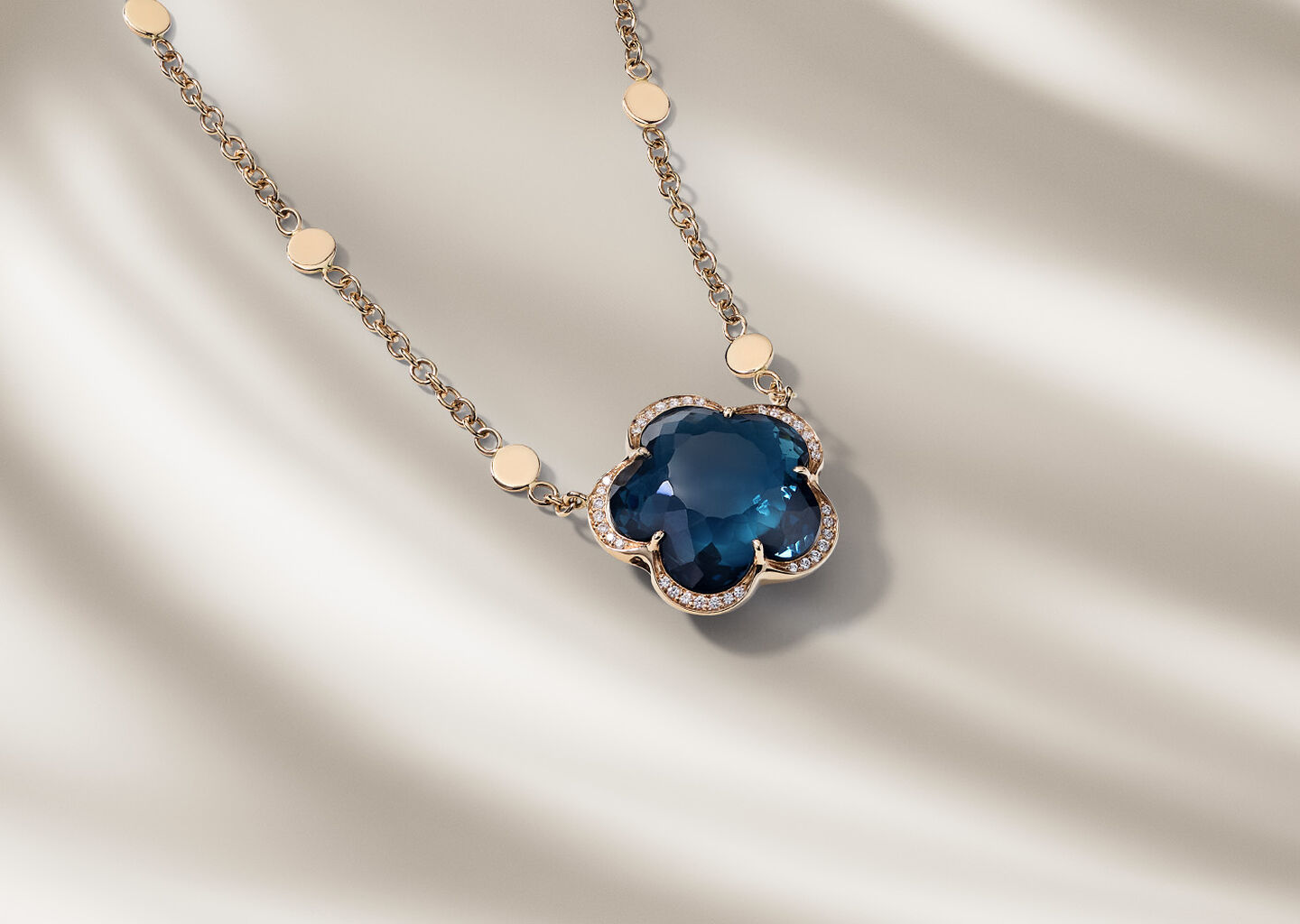 Pasquale Bruni Bon Ton necklace on a blue background.