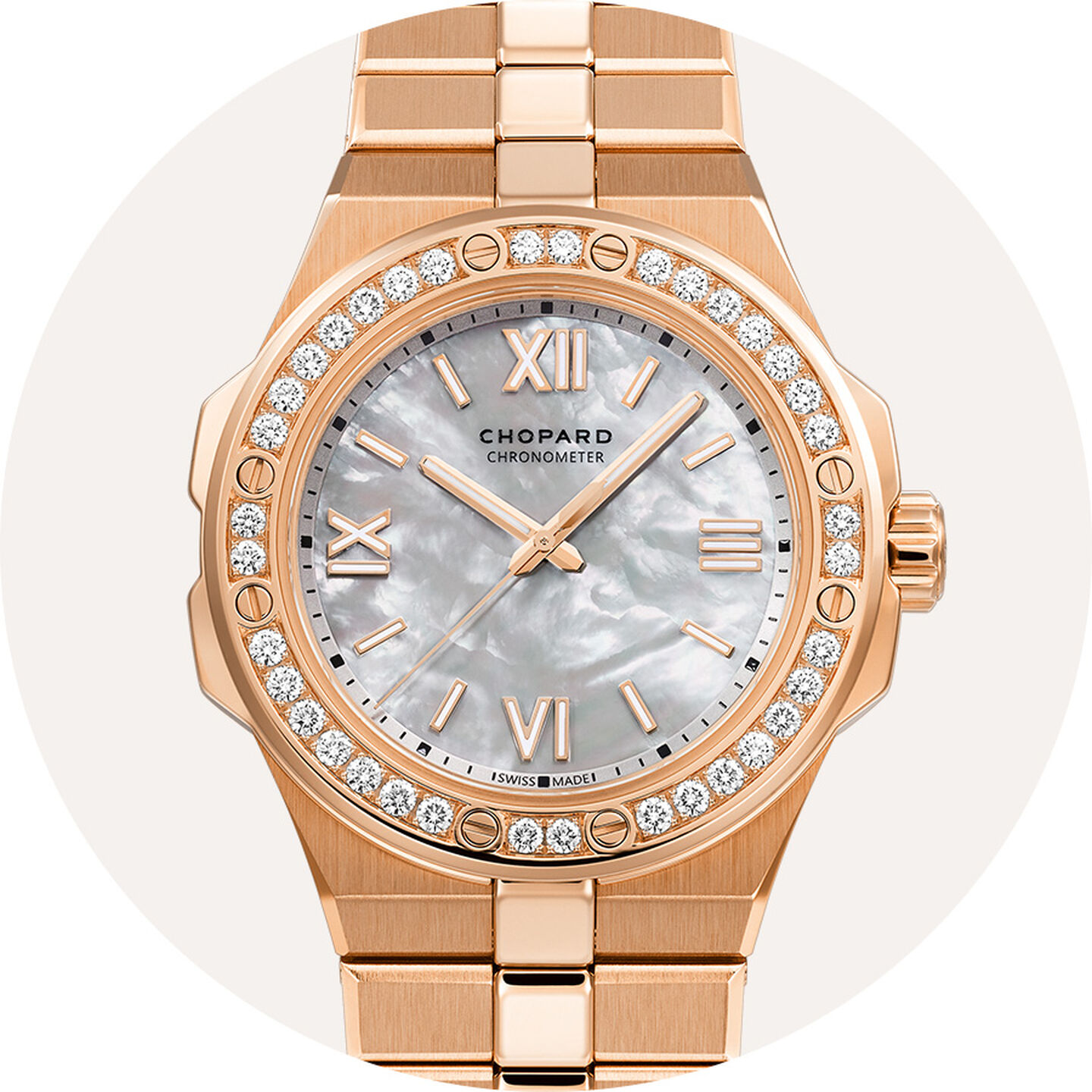 Chopard watch on a grey background.