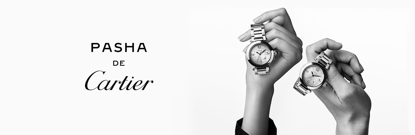 "Pasha de Cartier" text next to two hands holding up Pasha de Cartier watches