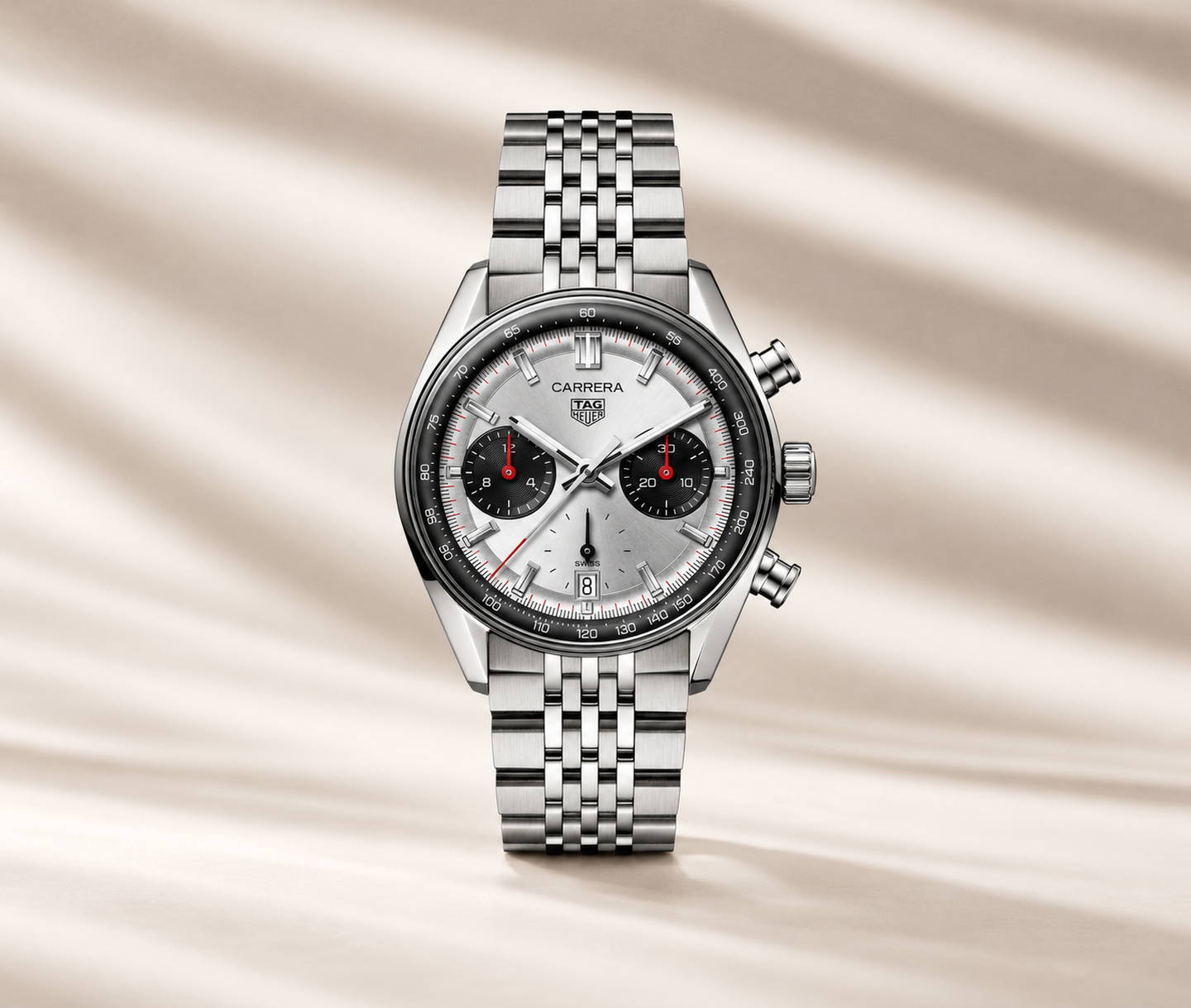 TAG Heuer watch on a beige background.