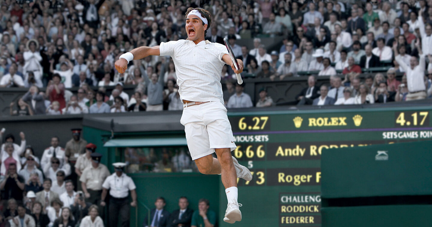 Tennis player jumping up in celebration