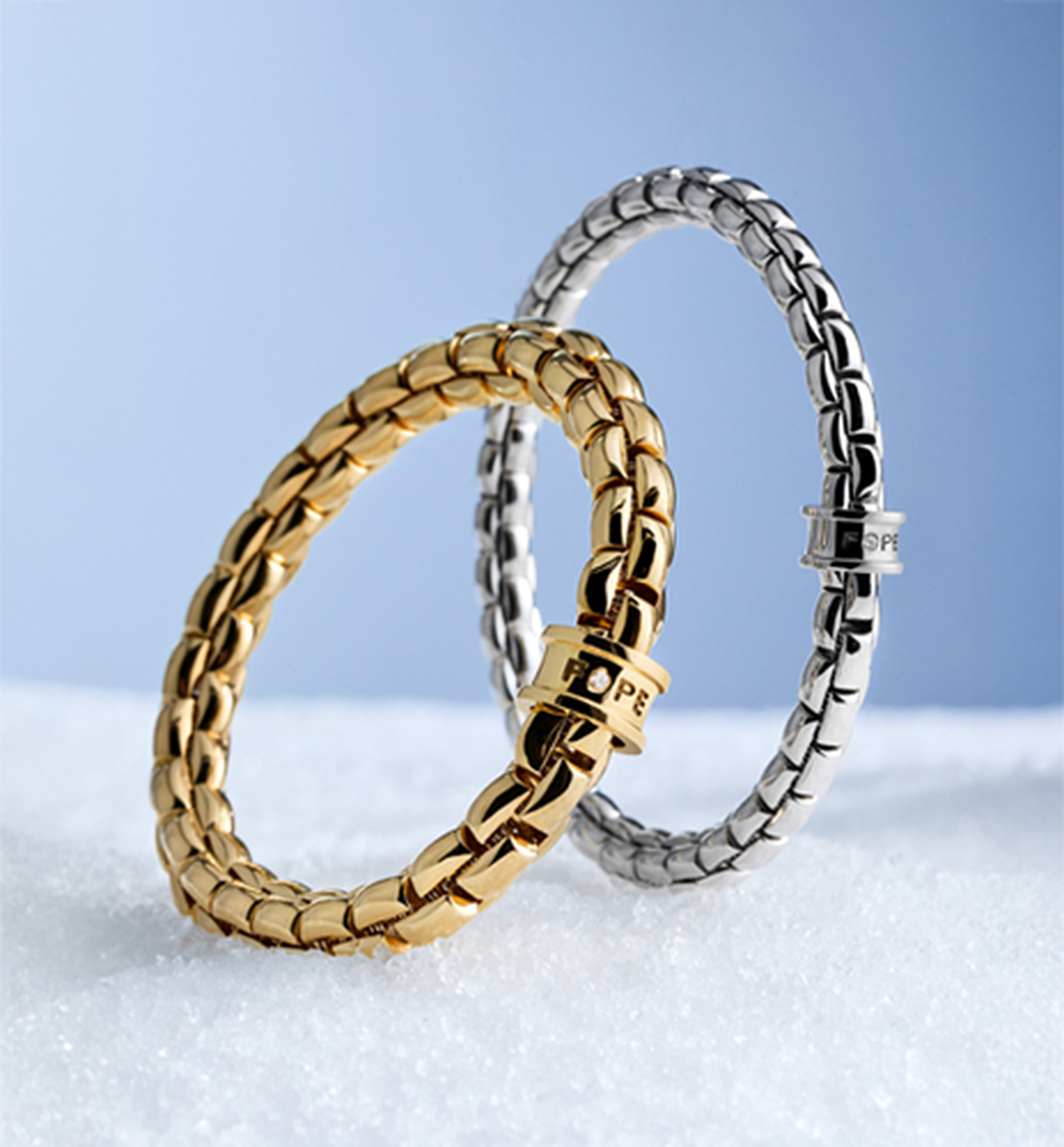 FOPE gold rings on a blue background.