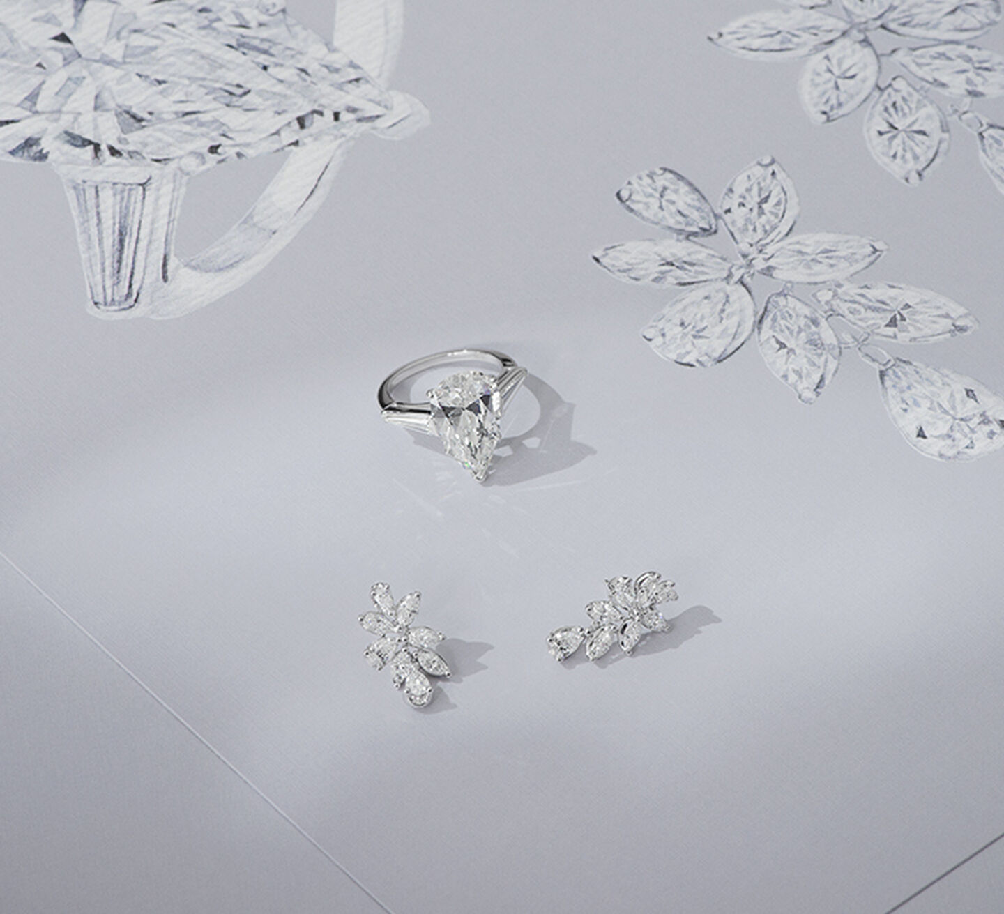 A white gold diamond ring with matching earrings