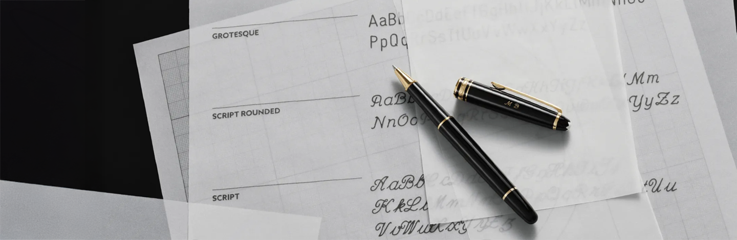 A closeup of a Montblanc pen with sheets of papers.