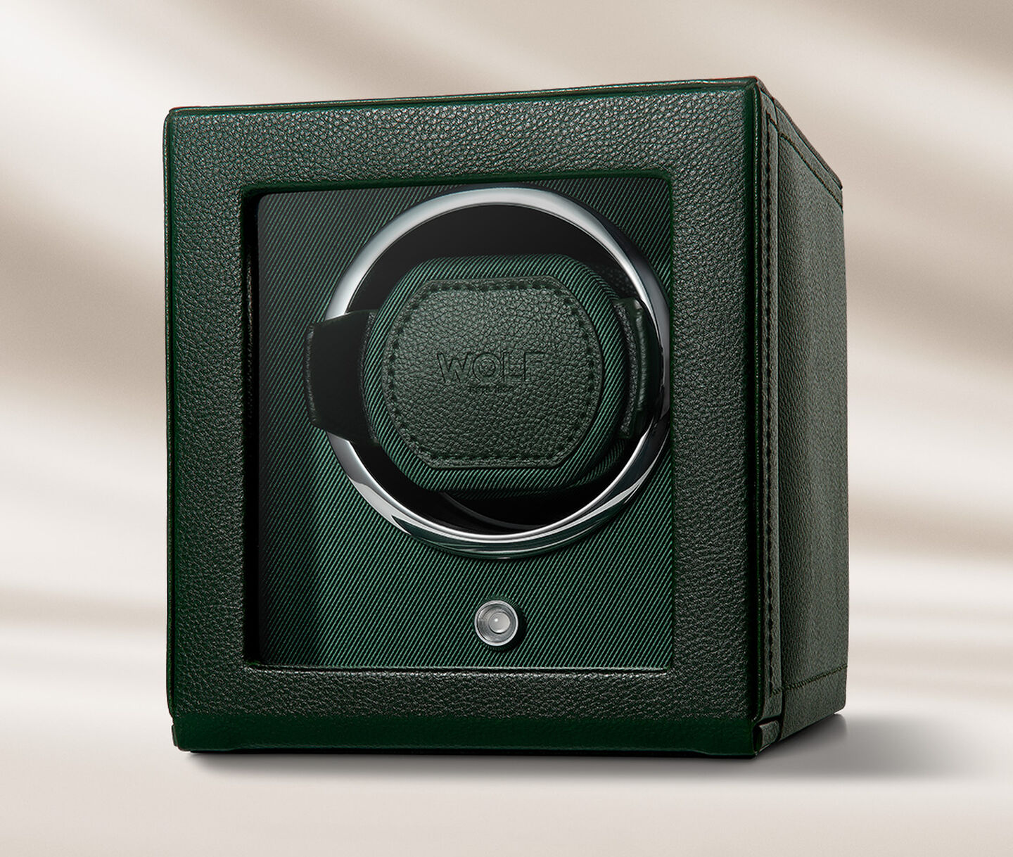 WOLF leather watch winder on a beige background.