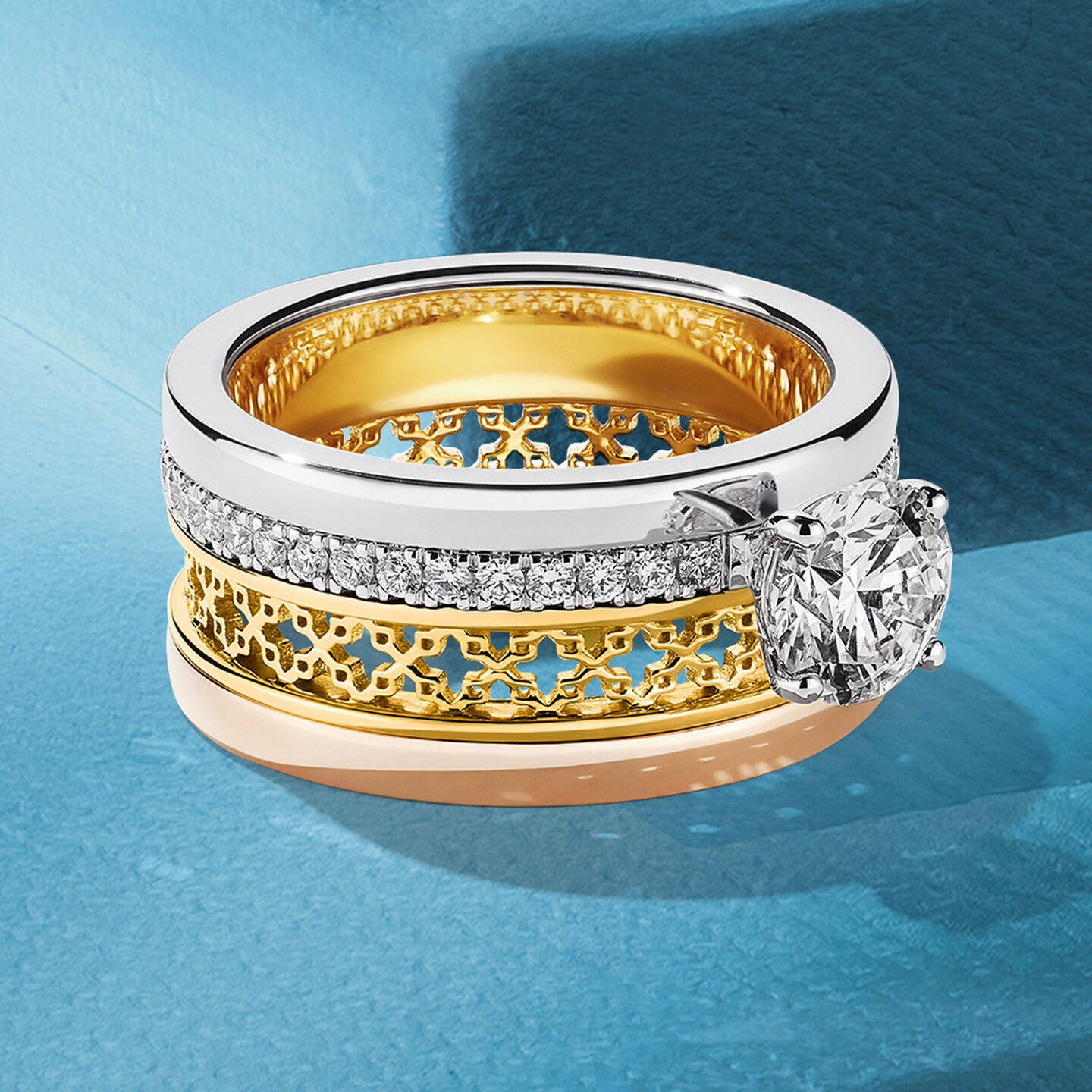 Birks Dare to Dream diamond engagement ring on a blue background.