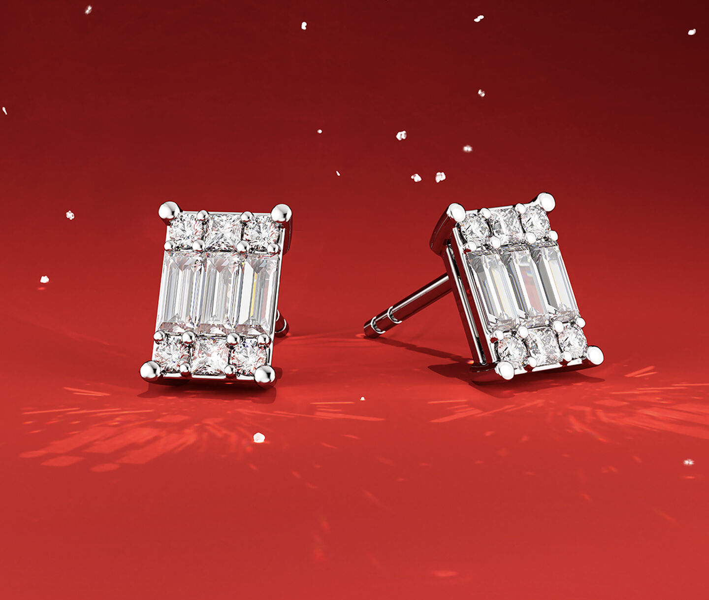 Birks Essential earrings on a red holiday background.