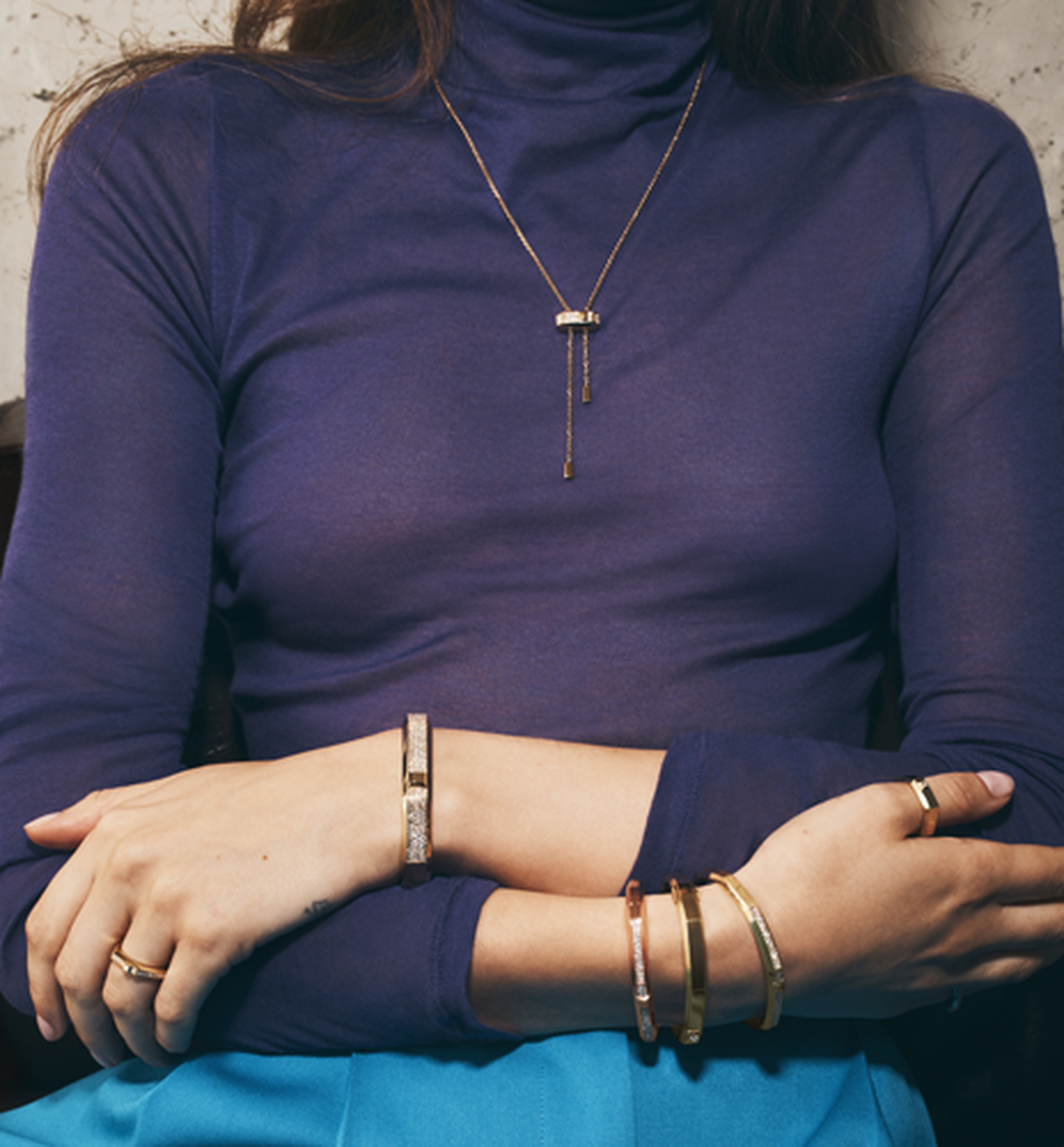 A woman wearing the Messika Moderniste jewellery collection.