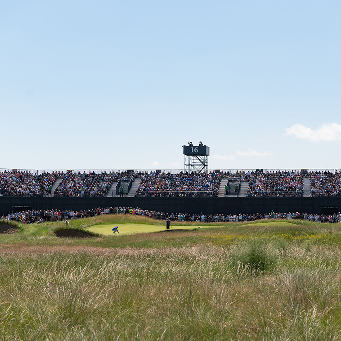 Crowded stands overlooking the course