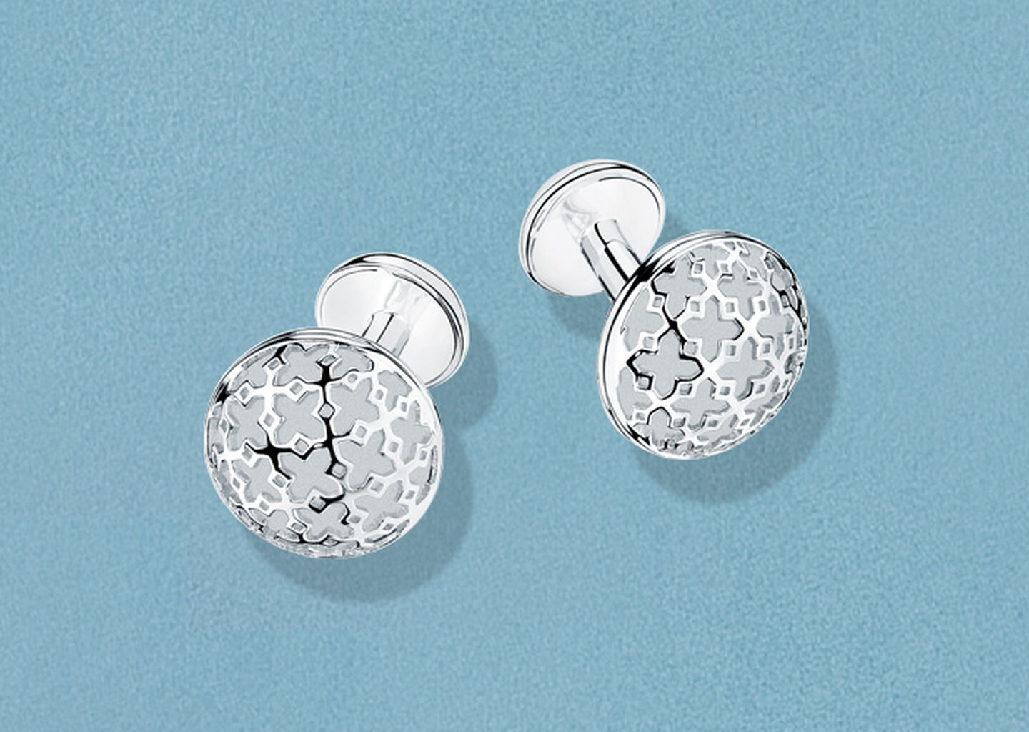 Birks Dare to Dream cufflink on a blue background.
