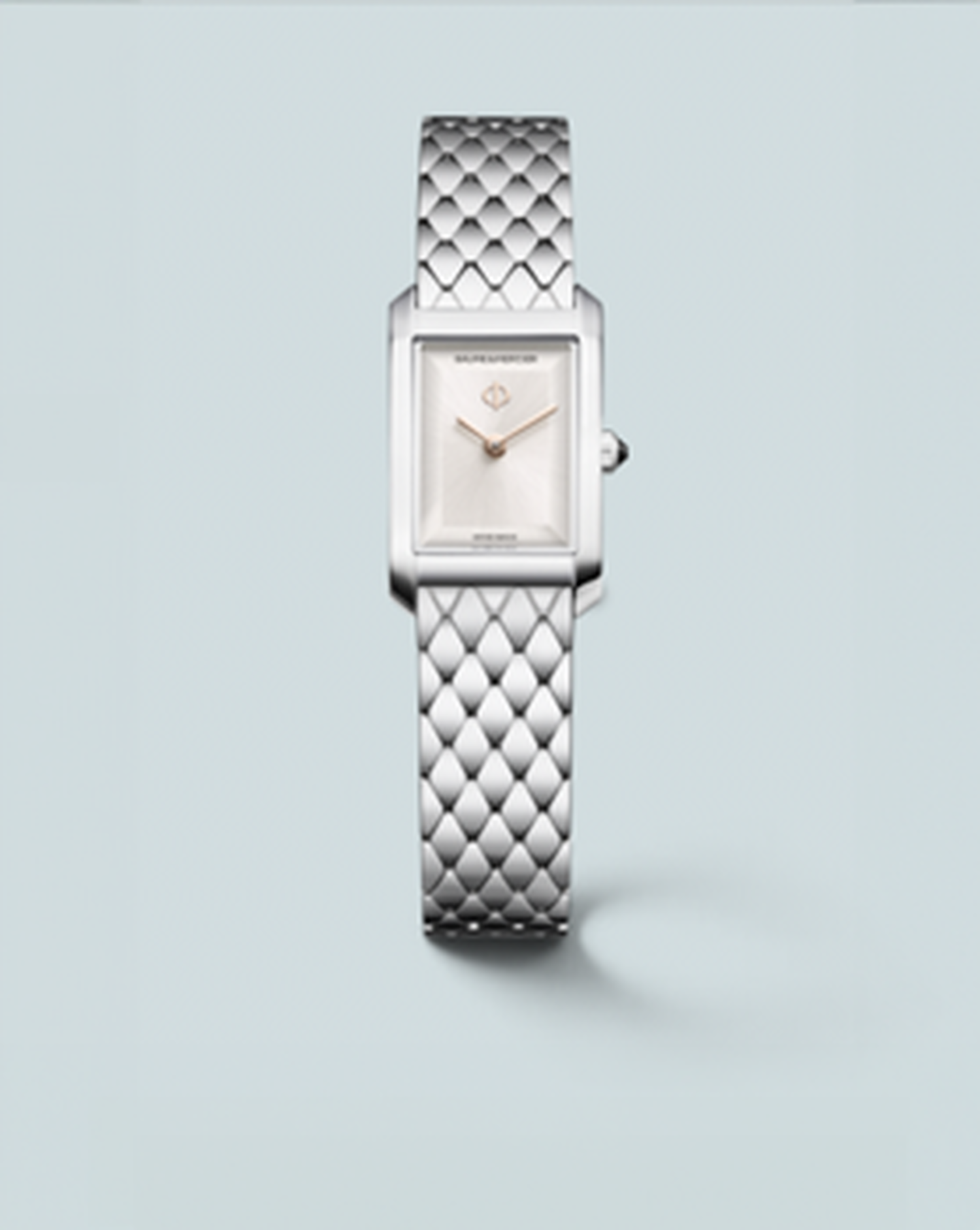 Baume & Mercier Hampton watch on a light blue background.