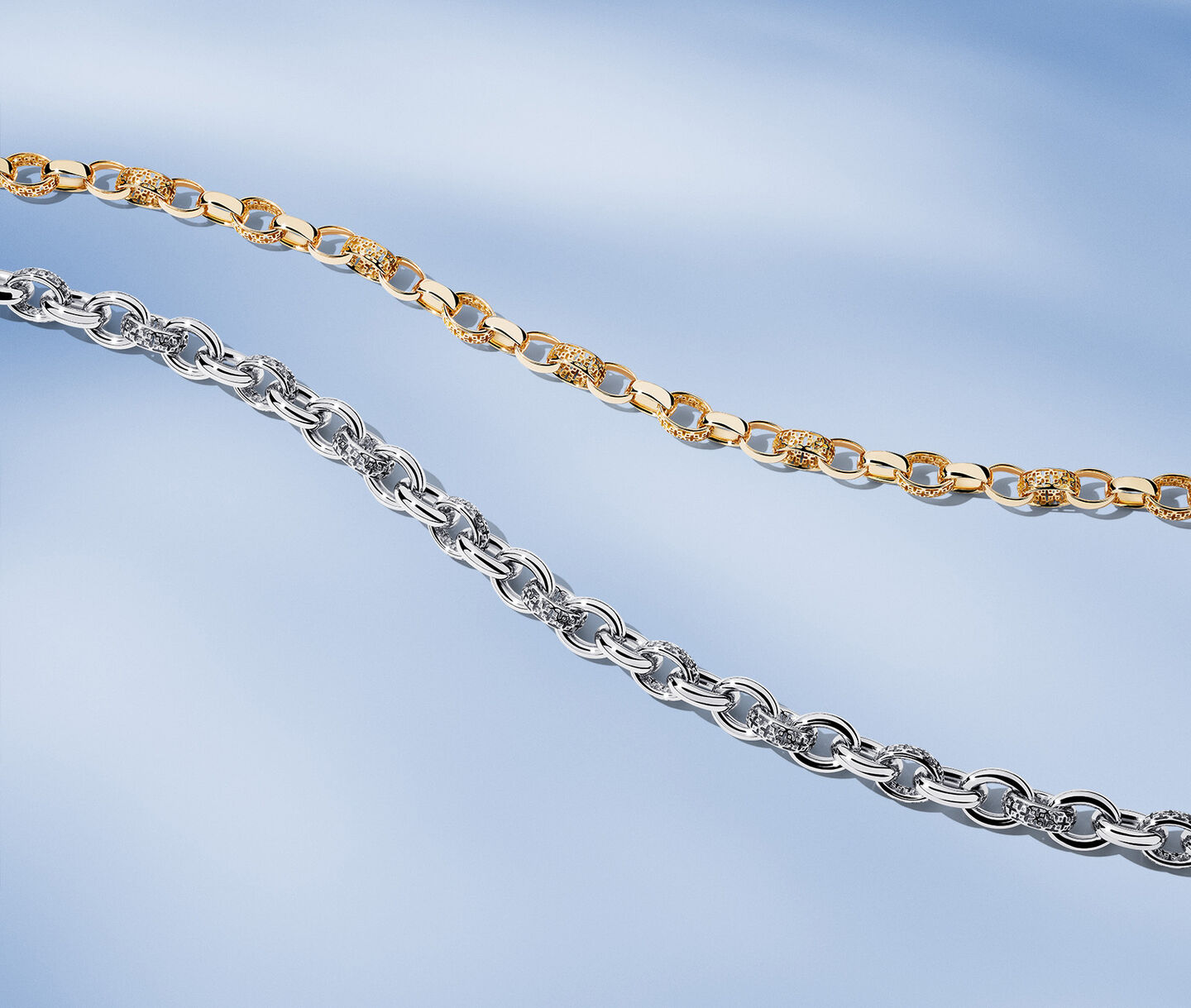 Birks Dare to Dream chain necklaces on a blue background.