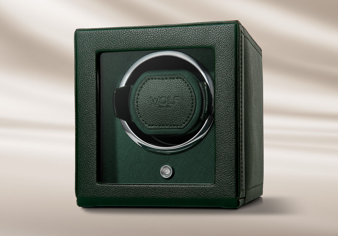 Green Wolf winder on a beige background.