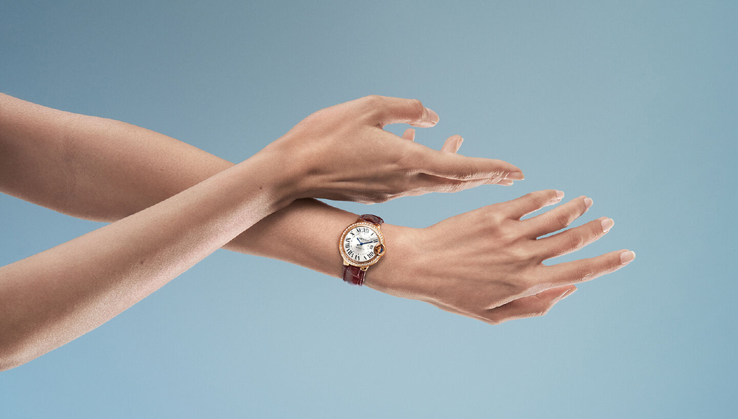 A woman wearing a Ballon Bleu de Cartier watch.