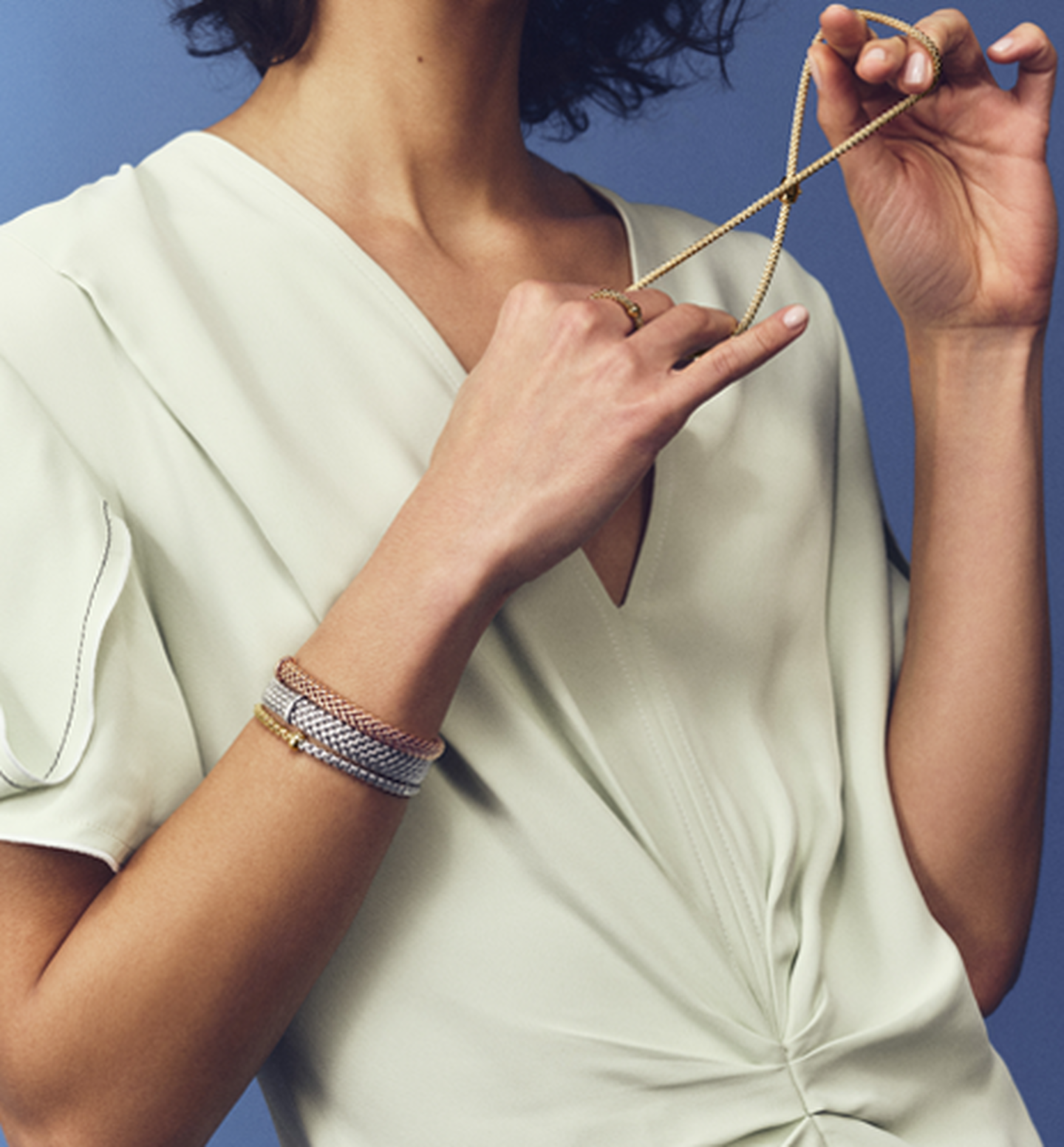 A woman wearing FOPE jewellery.