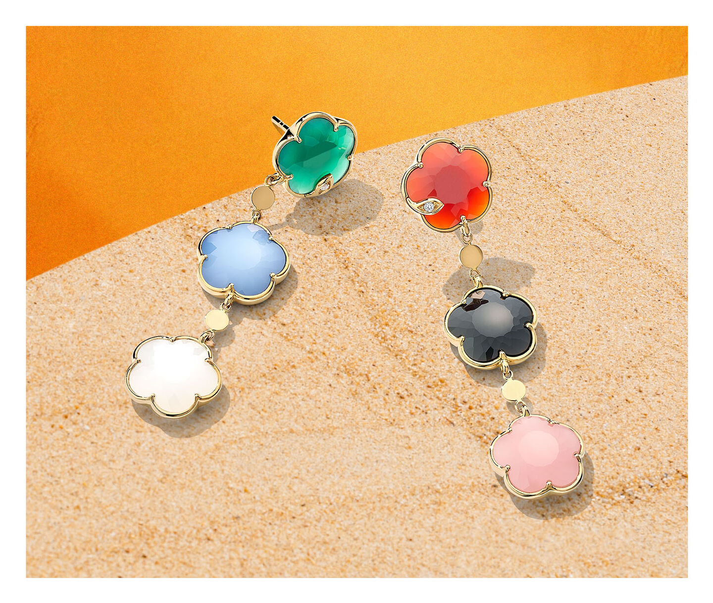 Pasquale Bruni Petit Joli Earrings on a sandy background.
