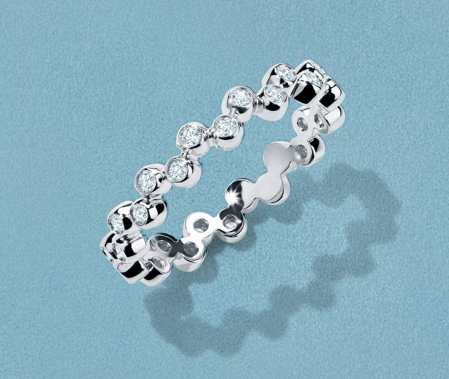 Birks Iconic diamond Splash ring on a blue background.