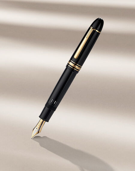Montblanc fountain pen on a beige background.