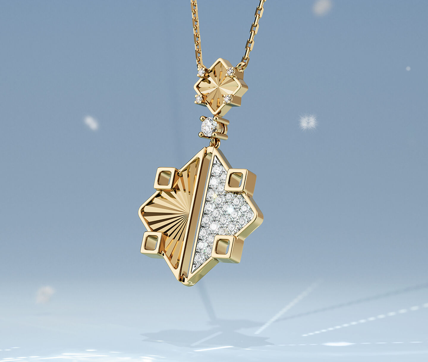Birks Muse yellow gold drop necklace on a blue snowy background.