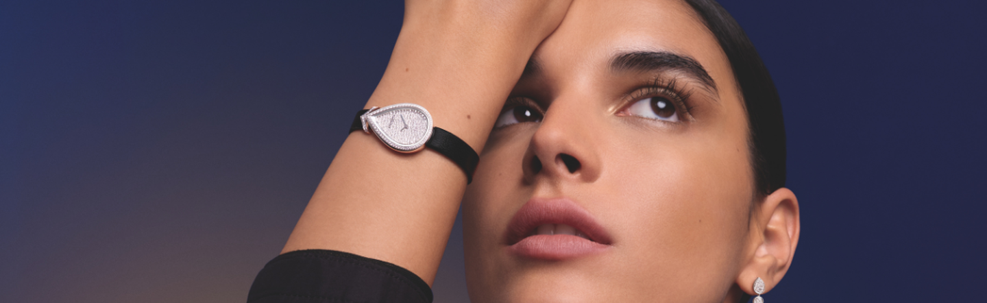 A Chaumet Jos&eacute;phine watch on a dark blue background.