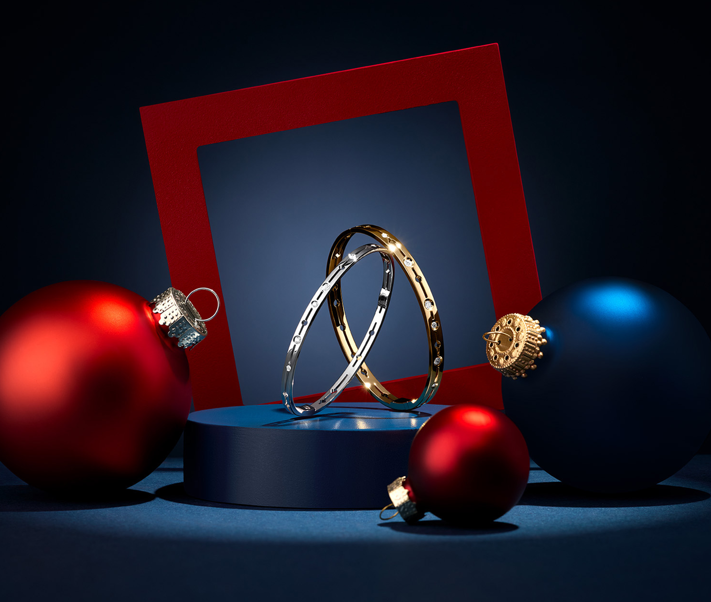 Yellow and white gold Pulse bracelets by dinh van on a holiday background.