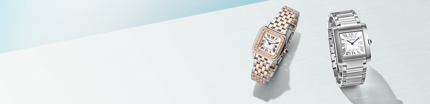 Cartier Panthere and Tank watches on a light blue background